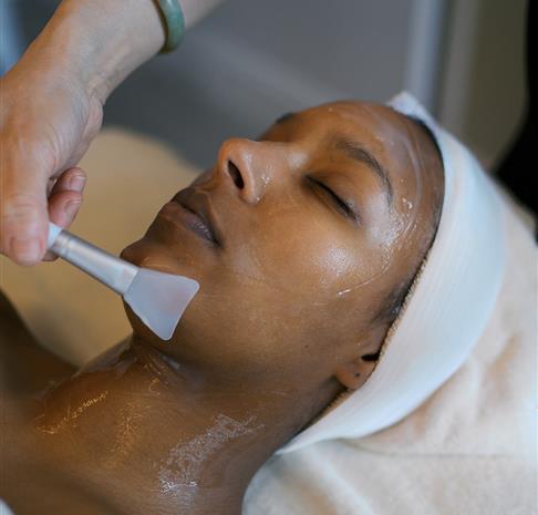 a woman getting a soothing facial