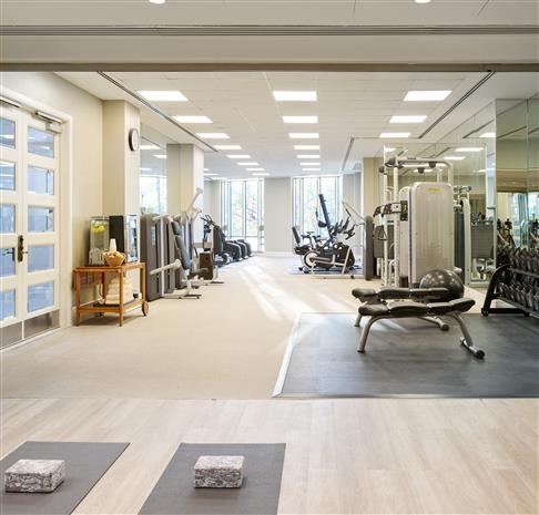 Fitness Center with weights and yoga mats for hotel guests