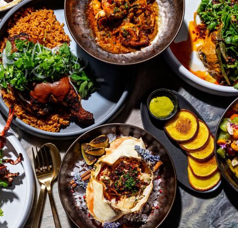 tablescape of food from dogon by kwame onwuachi