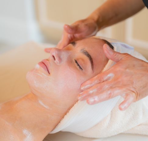 a woman getting a soothing facial