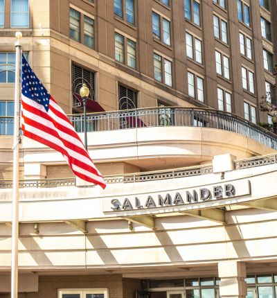 American flag flying outside the Salamander DC on a sunny day