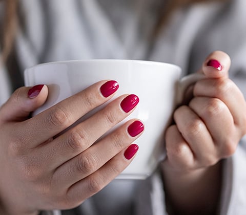 Holding Coffee Cup