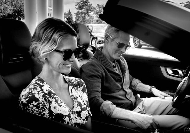 A guy driving with a woman in the passenger seat