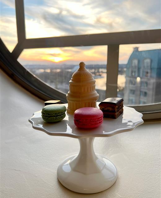 A plate of deserts sitting on a window