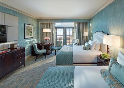 A deluxe bedroom with blue walls