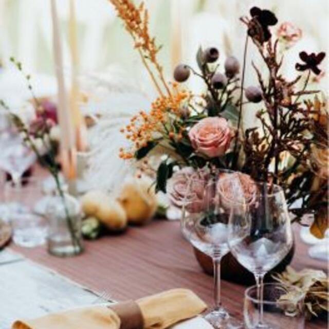 flowers and wine glasses on table