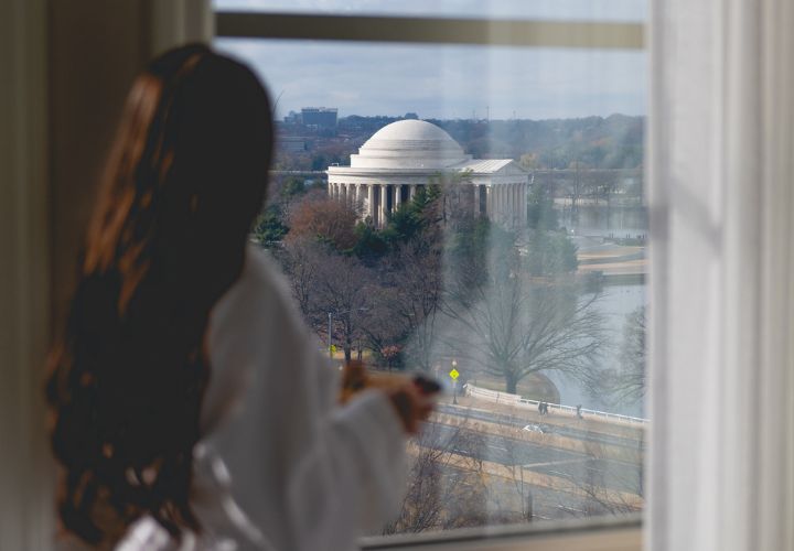 Woman in robe overlooking Washington DC
