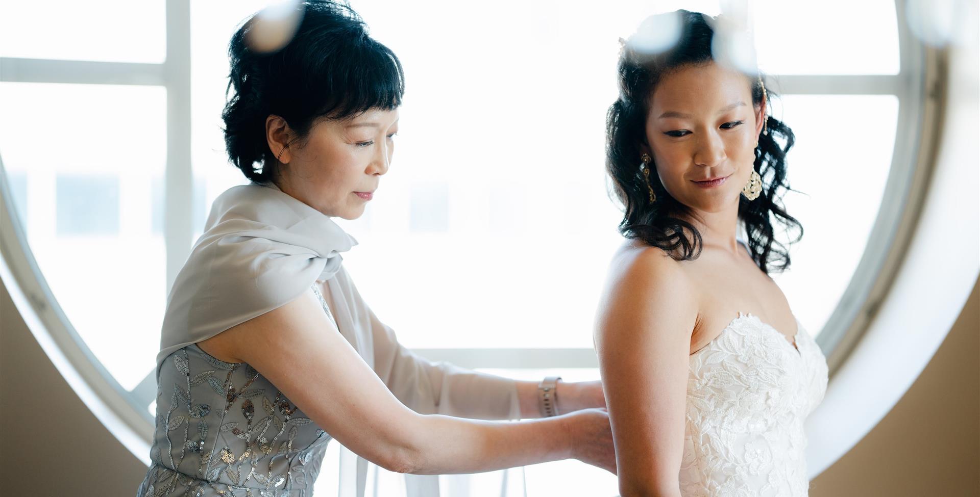 Bride with Mom at window